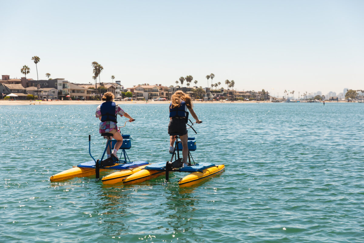 Riders on hydrobikes on Alamitos Bay in daylight