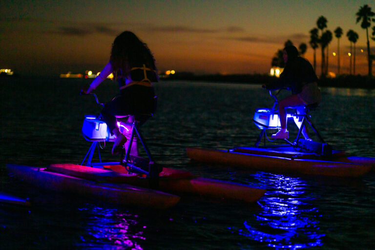 LED-lit hydrobikes on the bay after dark