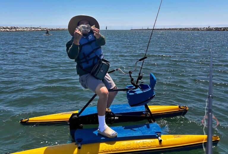 A rider fishing from a hydrobike on Alamitos Bay