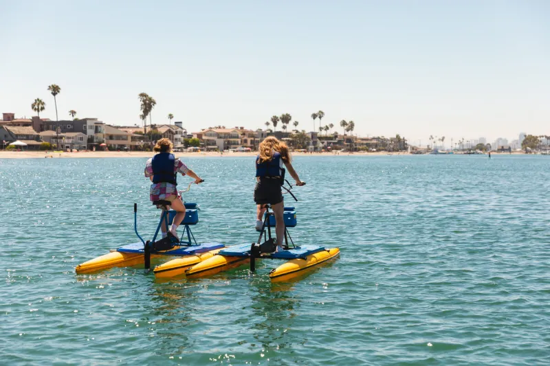 Riders on hydrobikes on Alamitos Bay in daylight