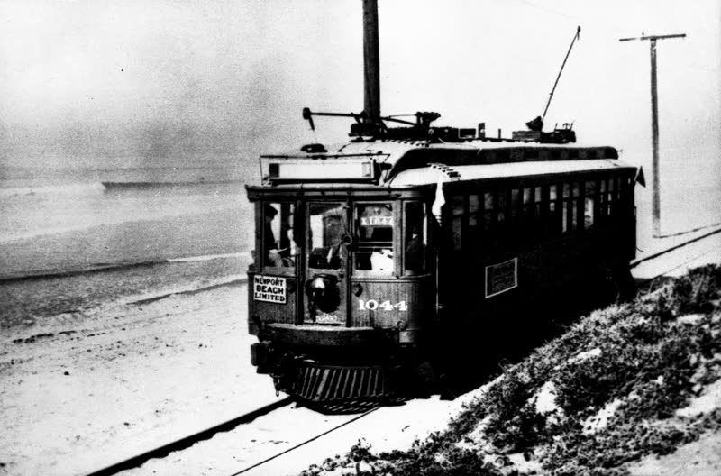 A Pacific Electric Red Car beside the sand at Huntington Beach