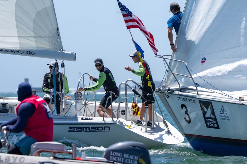 Crews working on two Catalina 37 sailboats racing side by side in the Congressional Cup