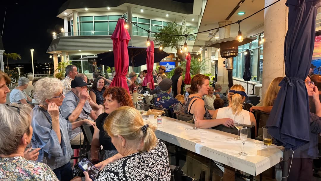 The Marina Wine patio full of guests on an evening at Alamitos Bay Landing